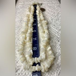Double strand mother of pearl necklace. Approximately 9 Inches long.